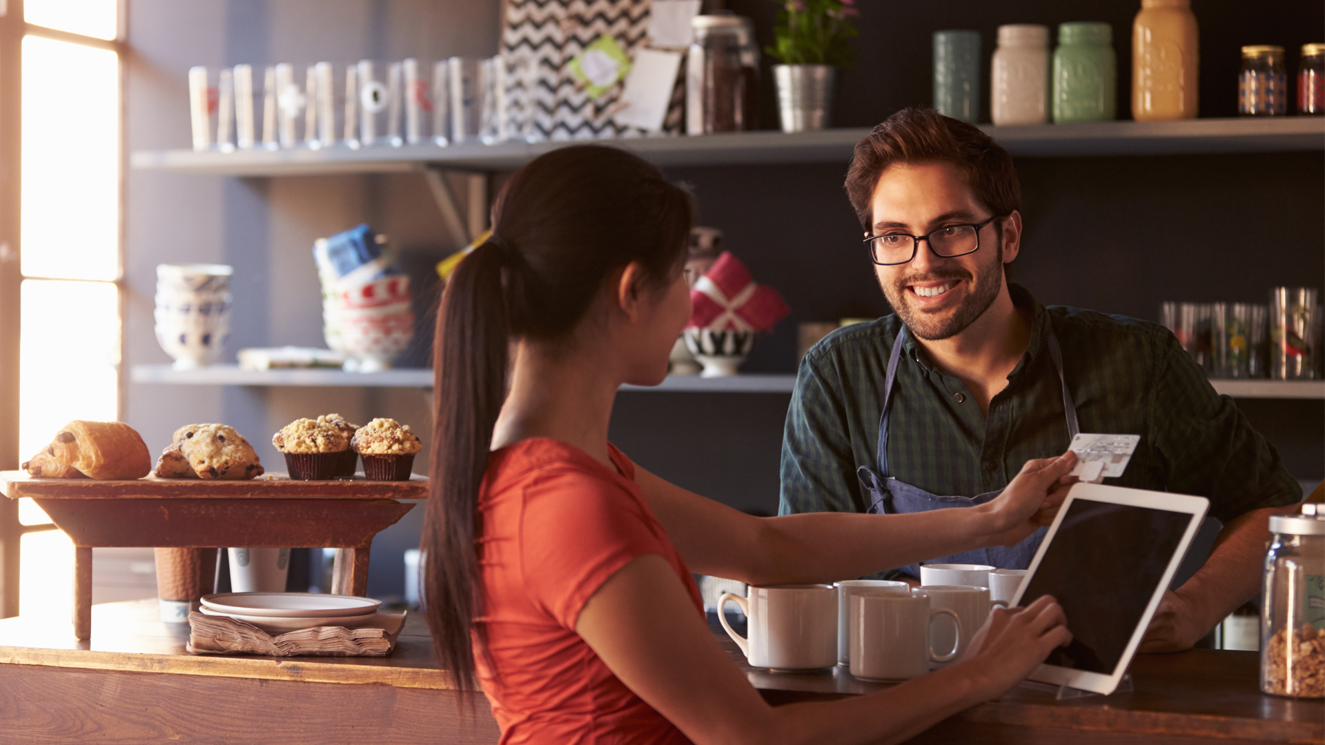 coffee shop worker helping customer