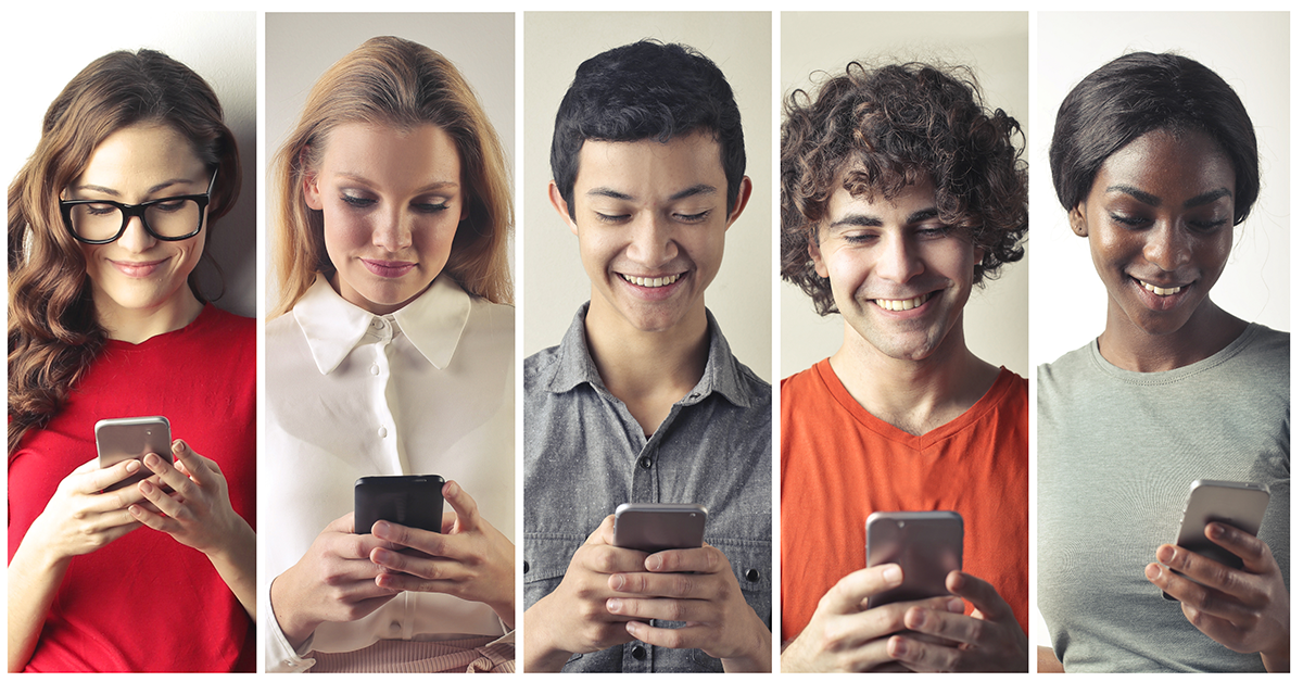 group of people looking at facebook ads on their phones